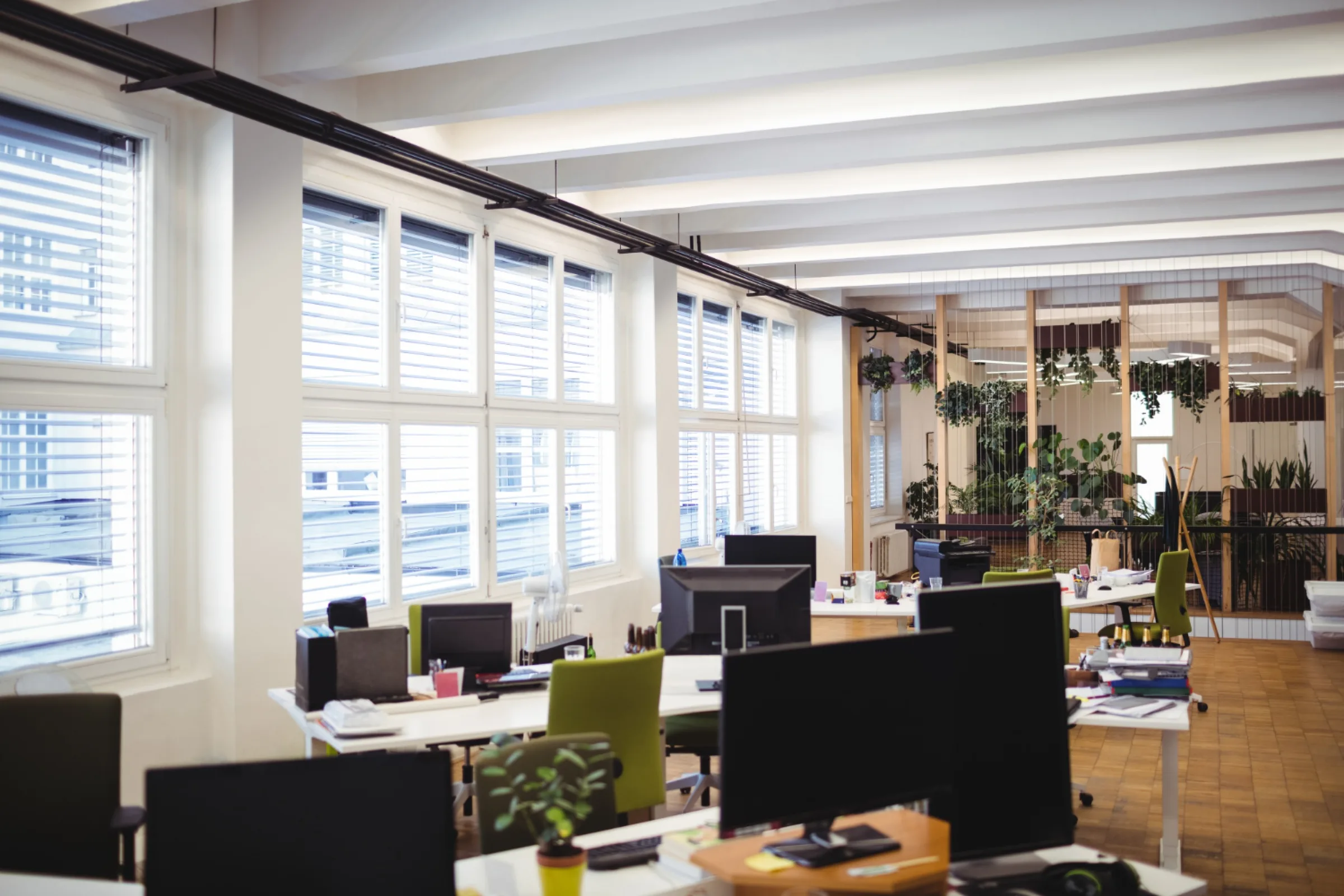 An open-plan office with rows of workstations
